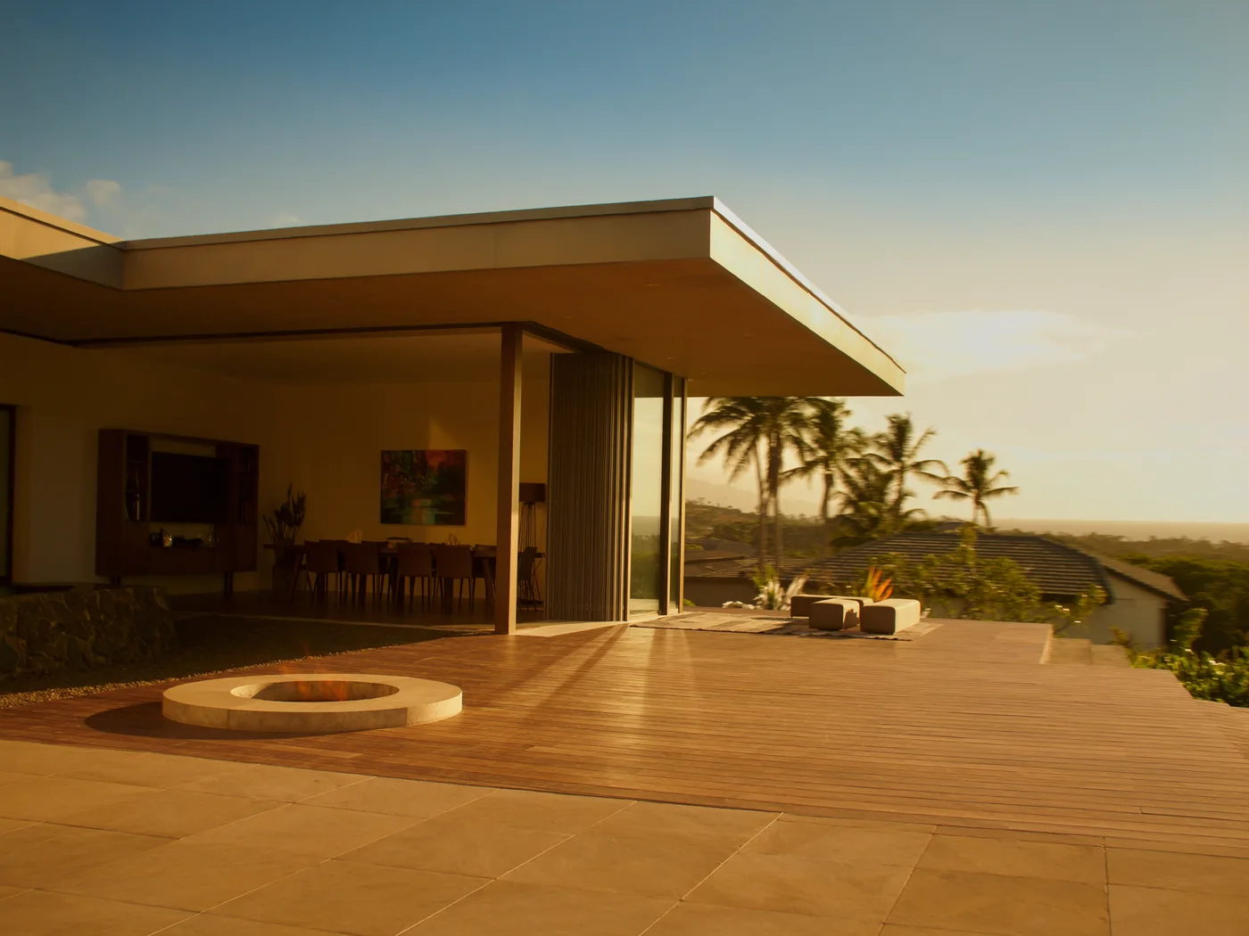 Corner multi-slide door system open to a hillside deck
